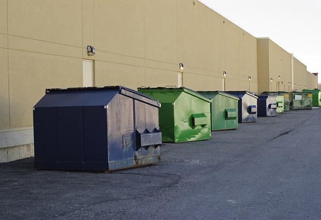 big yellow dumpsters on a construction lot in Bowie, MD